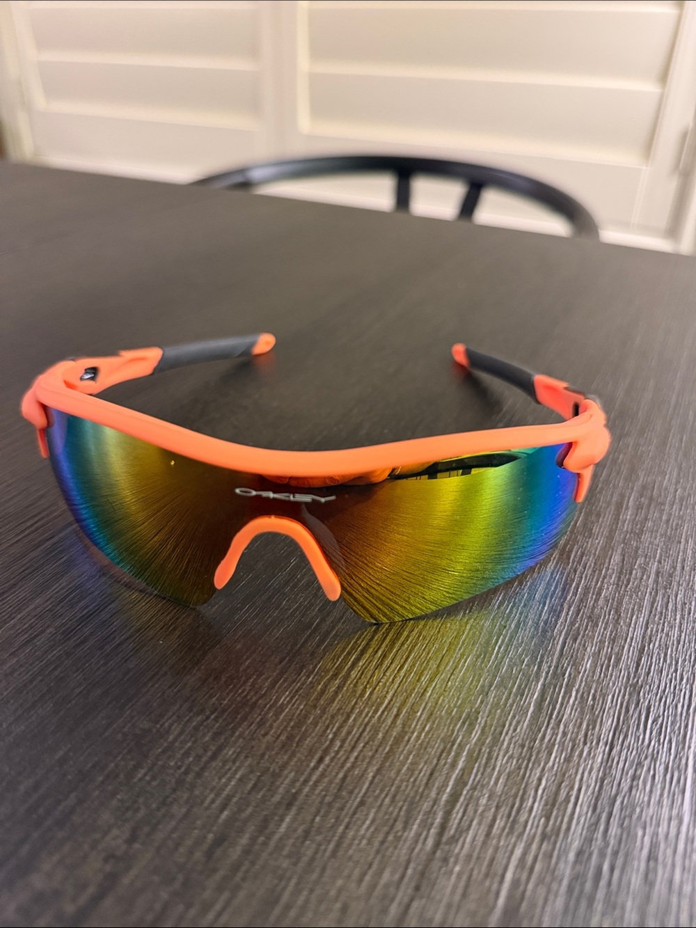 Oakley men’s Orange Frame Sunglasses with Rainbow Mirrored Lens